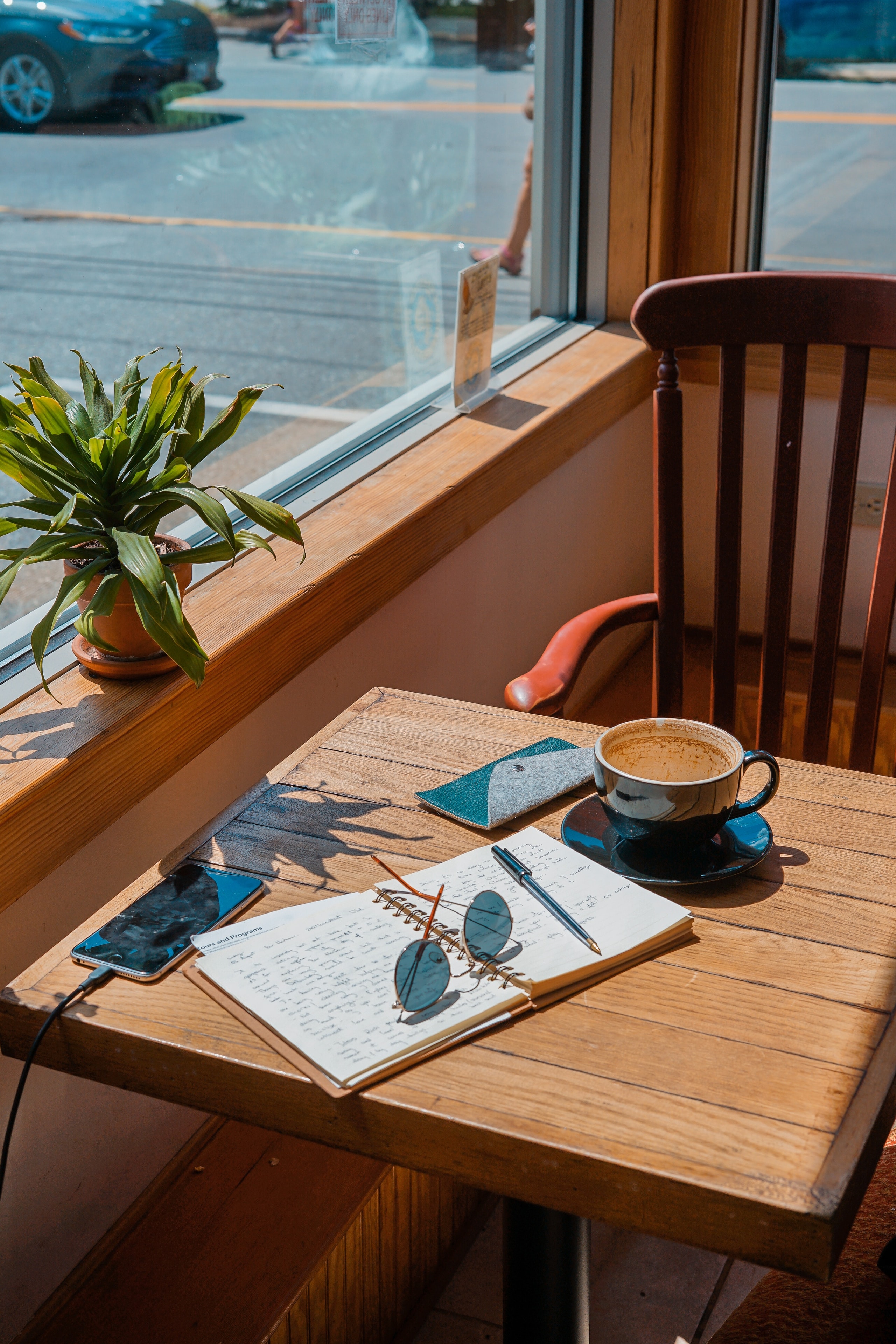 Small business owner working on a laptop with coffee